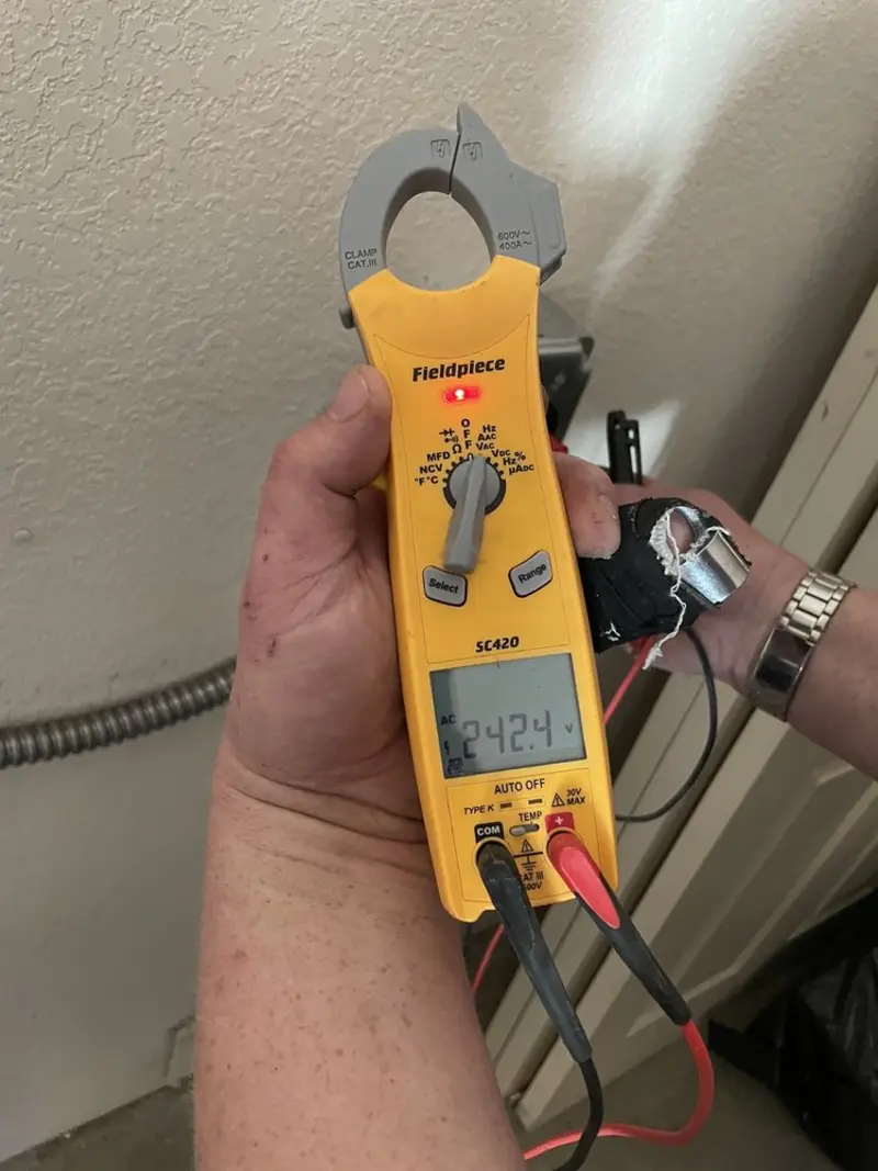 Voltage testing with clamp meter during Outlet Installation in Minden